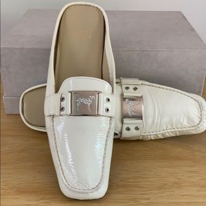 Patent leather mules by Stuart Weitzman